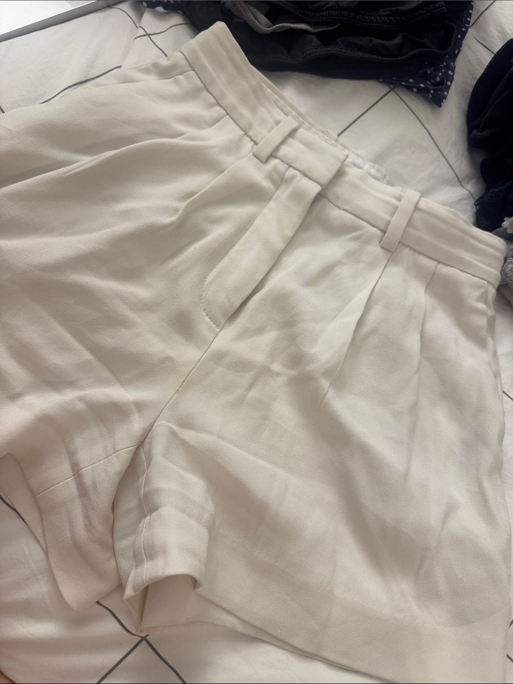 High-Waisted Pleated Cream Shorts aritzia